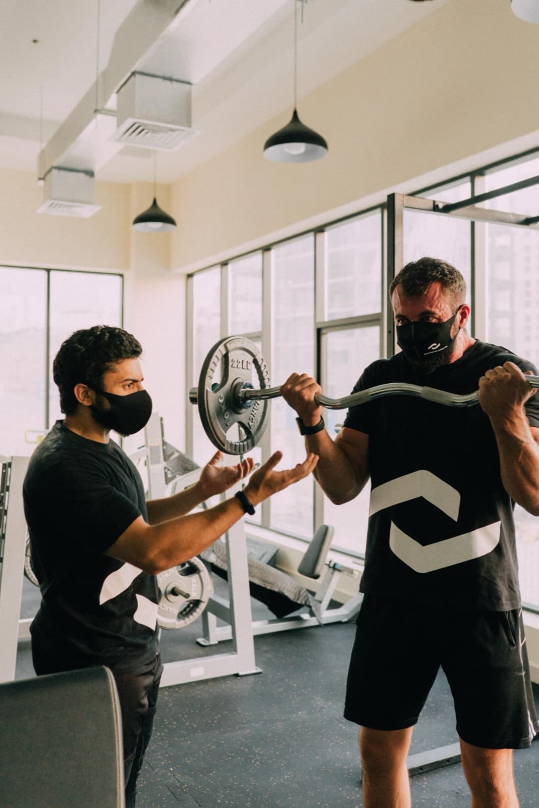 Coach guiding a tailored personal training session